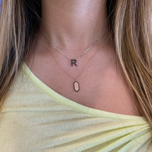 Female Model Wearing Black Diamond Initial Pendant on Paperclip Chain  - 14K 3.3GR gold   - 19 Black round diamonds totaling 0.22 carats.