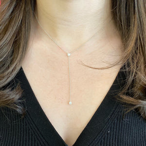 Female Model Wearing Halo Diamond Lariat Necklace  - 14K gold  - 0.12 cts round diamonds