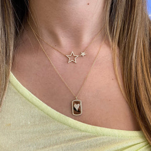 Female Model Wearing Pave Diamond Heart Dog Tag Necklace  - 14K gold weighing 2.39 grams  - 36 round diamonds totaling 0.18 carats