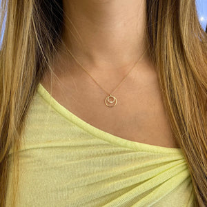 Female model wearing Diamond & Gold Open Circle Pendant - 14K gold - 0.11 cts round diamonds
