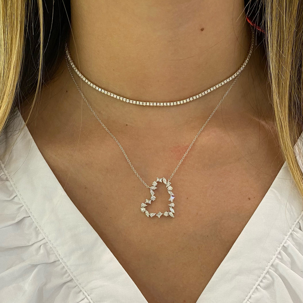 Female Model Wearing Mixed Shape Diamond Open Heart Pendant  - 14K gold weighing 3.06 grams  - 20 mixed shape diamonds totaling 1.19 carats
