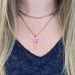 Female model wearing Ombre Pink Sapphire Heart Pendant -14K yellow gold weighing 1.31 grams  -103 pink sapphires weighing 0.82 carats