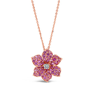 Pink Sapphire Flower Pendant  - 18K gold weighing 4.69 grams  - 1.54 total carat weight of pink sapphires  -0.13 ct round diamond