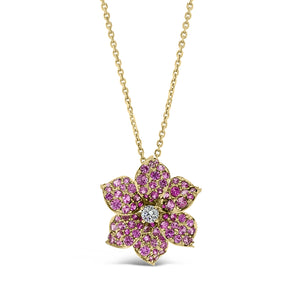 Pink Sapphire Flower Pendant  - 18K gold weighing 4.69 grams  - 1.54 total carat weight of pink sapphires  -0.13 ct round diamond