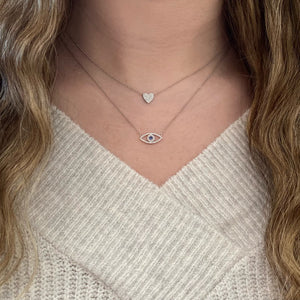 Female model wearing Pave Diamond Classic Heart Pendent Necklace - 14K gold weighing 1.65 grams  - 45 round diamonds weighing 0.10 carats
