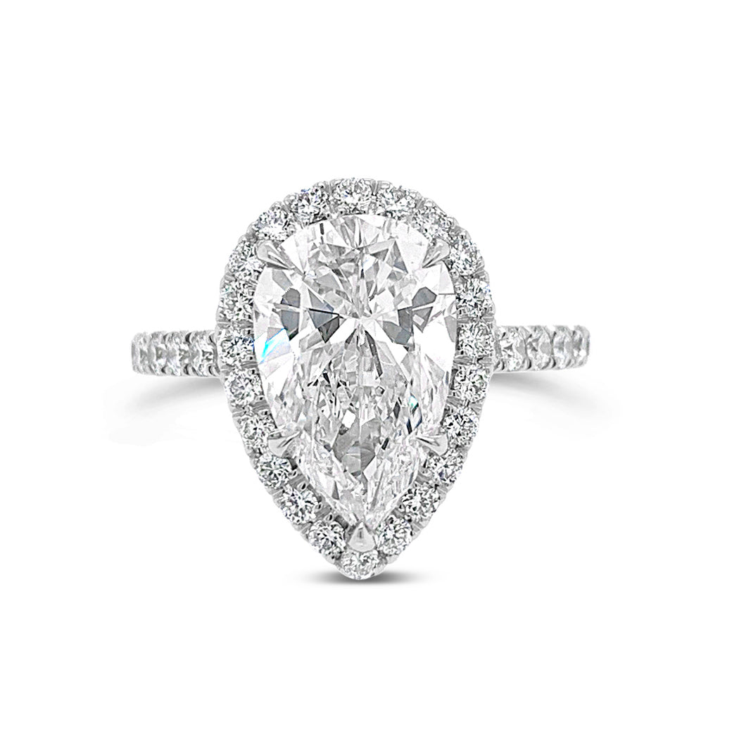 Pear Halo Diamond Engagement Ring  - 18 kt white gold weighting 4.70 grams  - 44 round diamonds totaling 0.87 carats