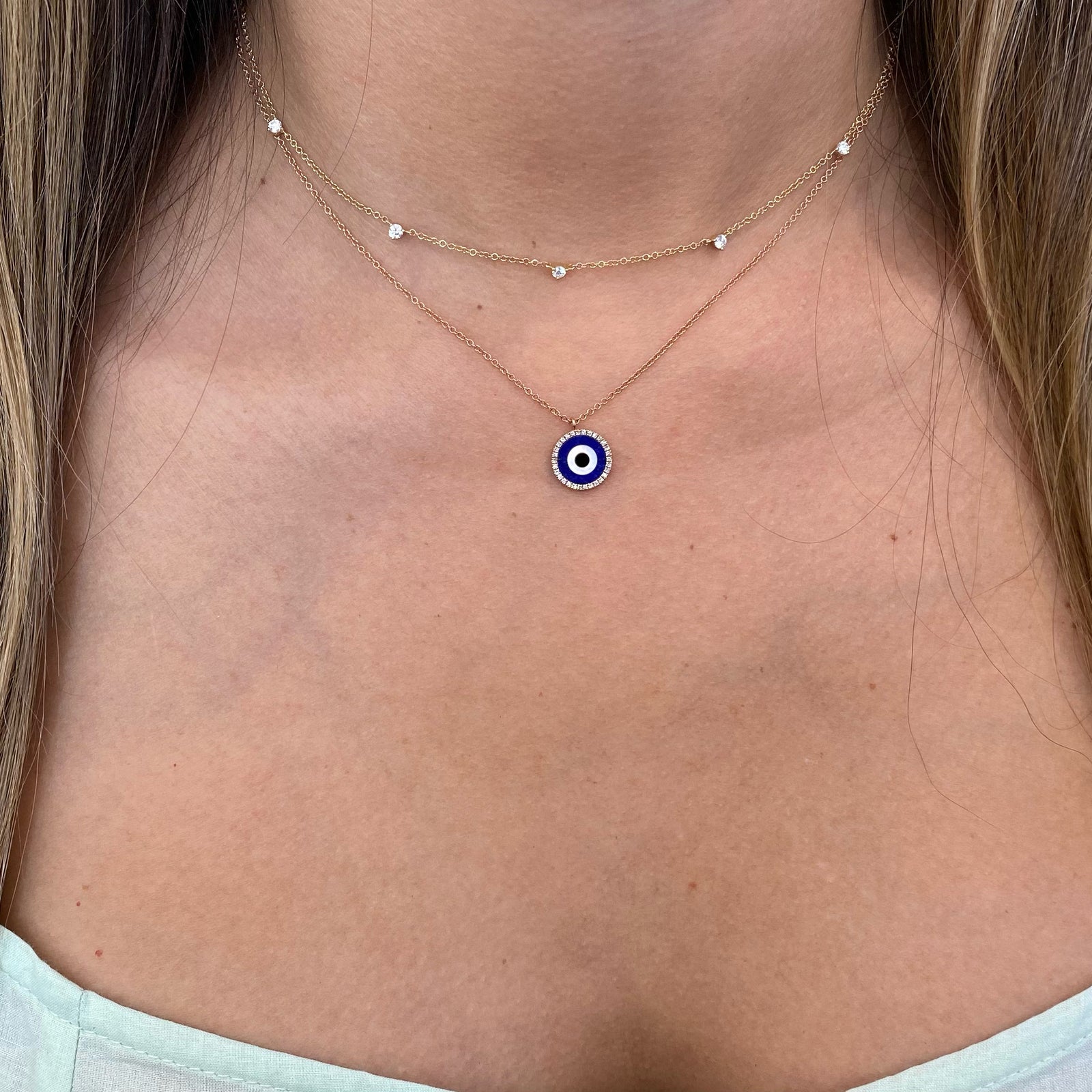 Lapis & Diamond Evil Eye Pendant  - 14K rose gold weighing 2.30 grams  - 30 round diamonds totaling 0.10 carats  - 0.47 ct lapis