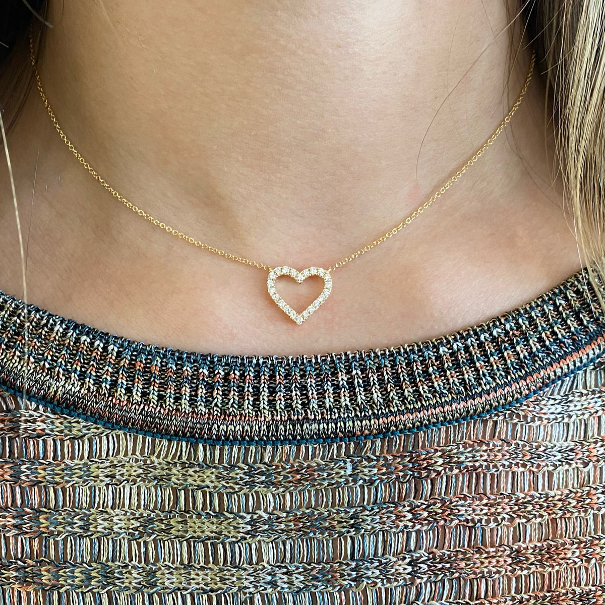 Female Model Wearing Diamond Open Heart Pendant  - 14K gold weighing 2.36 grams  - 22 round diamonds totaling 0.35 carats