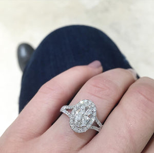 Oval Shaped Diamond Halo Engagement Ring  -18k gold, 3.82 grams  -38 round shared prong-set diamonds .79 carats