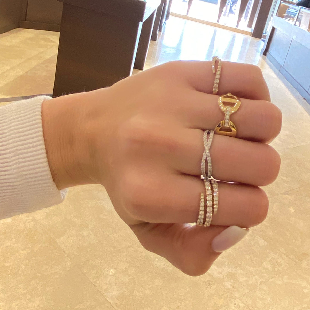 Female Model Wearing Diamond Open Double Wrap Ring  - 14K gold weighing 3.36 grams  - 29 round diamonds totaling 0.85 carats