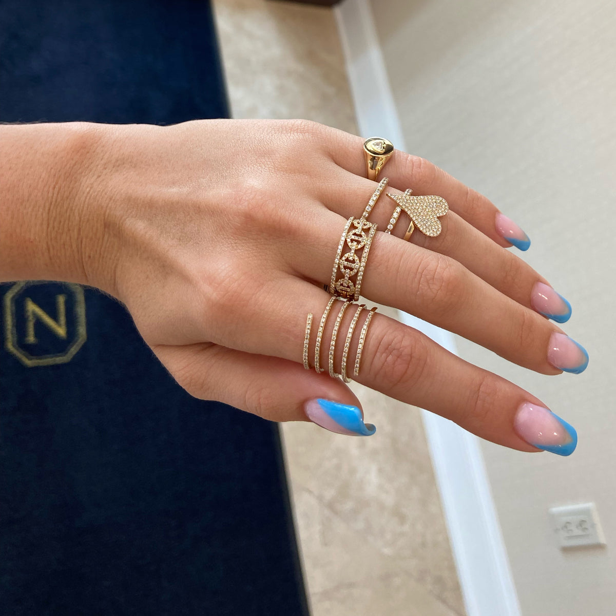 Female Model Wearing Pave Diamond Pointed Heart Ring  - 14K gold weighing 3.30 grams  - 116 round diamonds totaling 0.39 carats