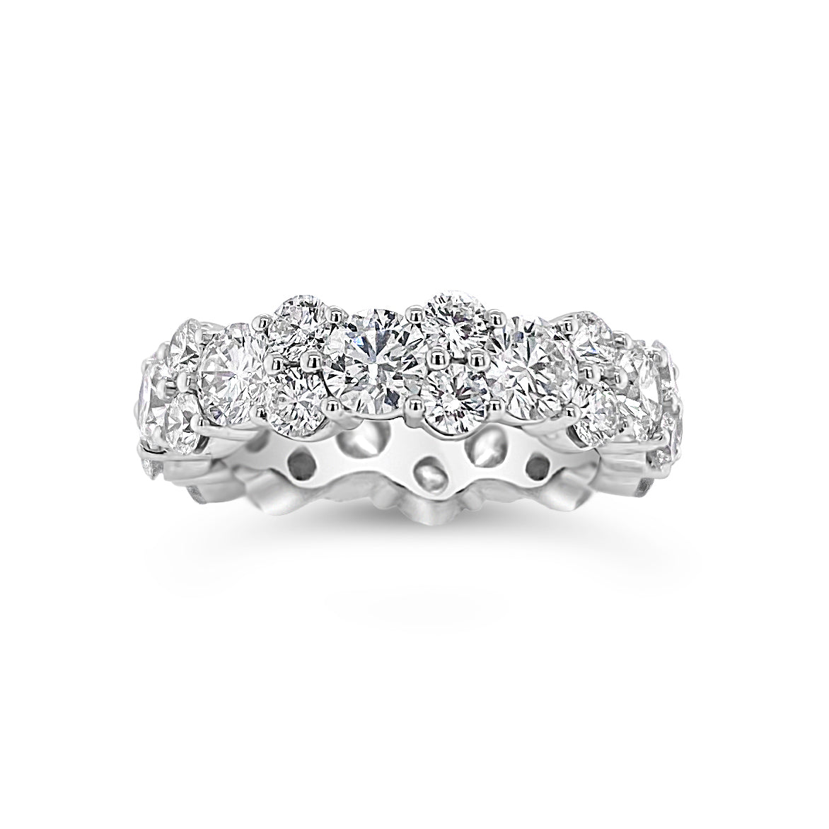 Staggered Diamond Eternity Band Lg   -18K gold weighing 6.91 grams  -11 round diamonds totaling 3.15 carats  -22 round diamonds totaling 1.87 carats