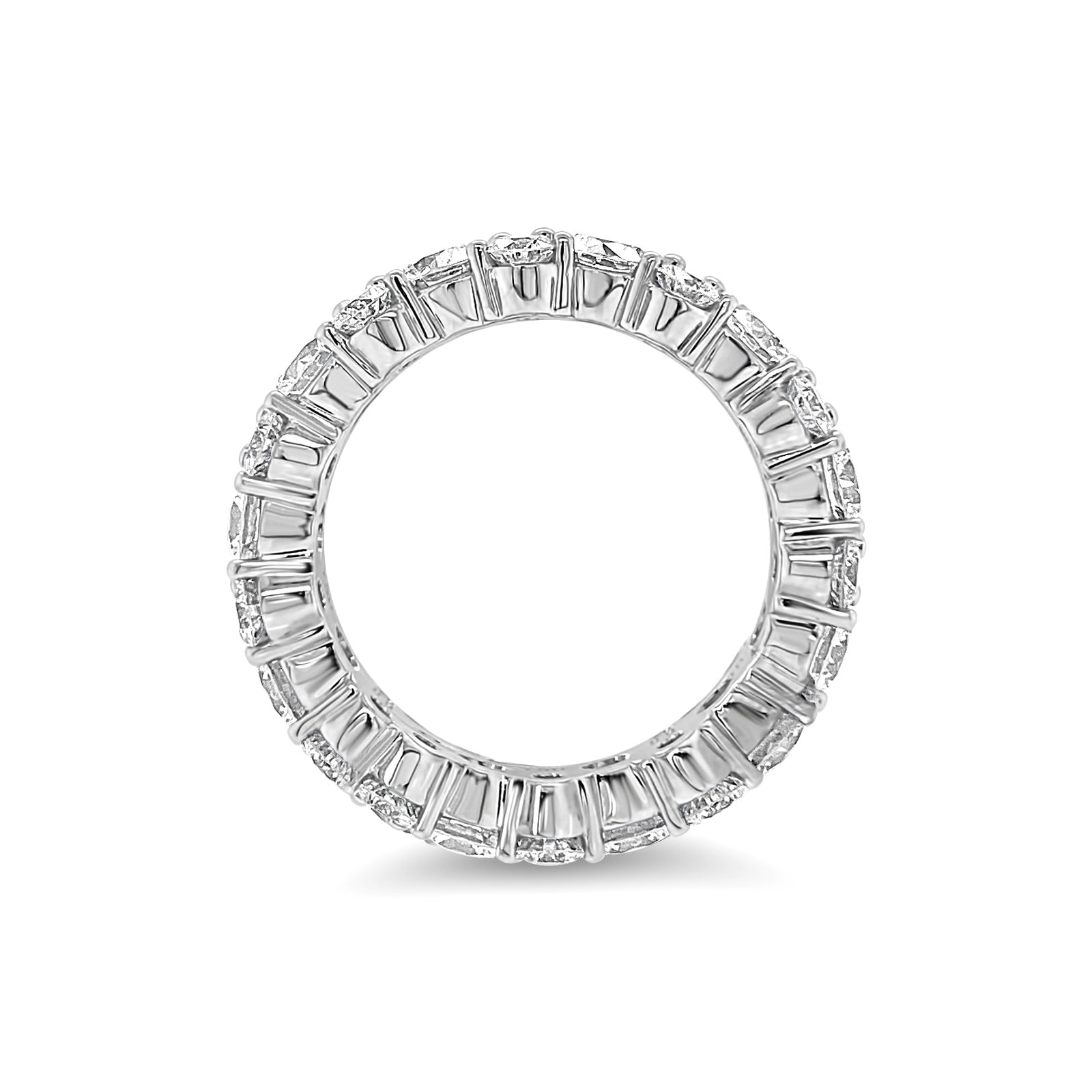 Staggered Diamond Eternity Band Lg   -18K gold weighing 6.91 grams  -11 round diamonds totaling 3.15 carats  -22 round diamonds totaling 1.87 carats