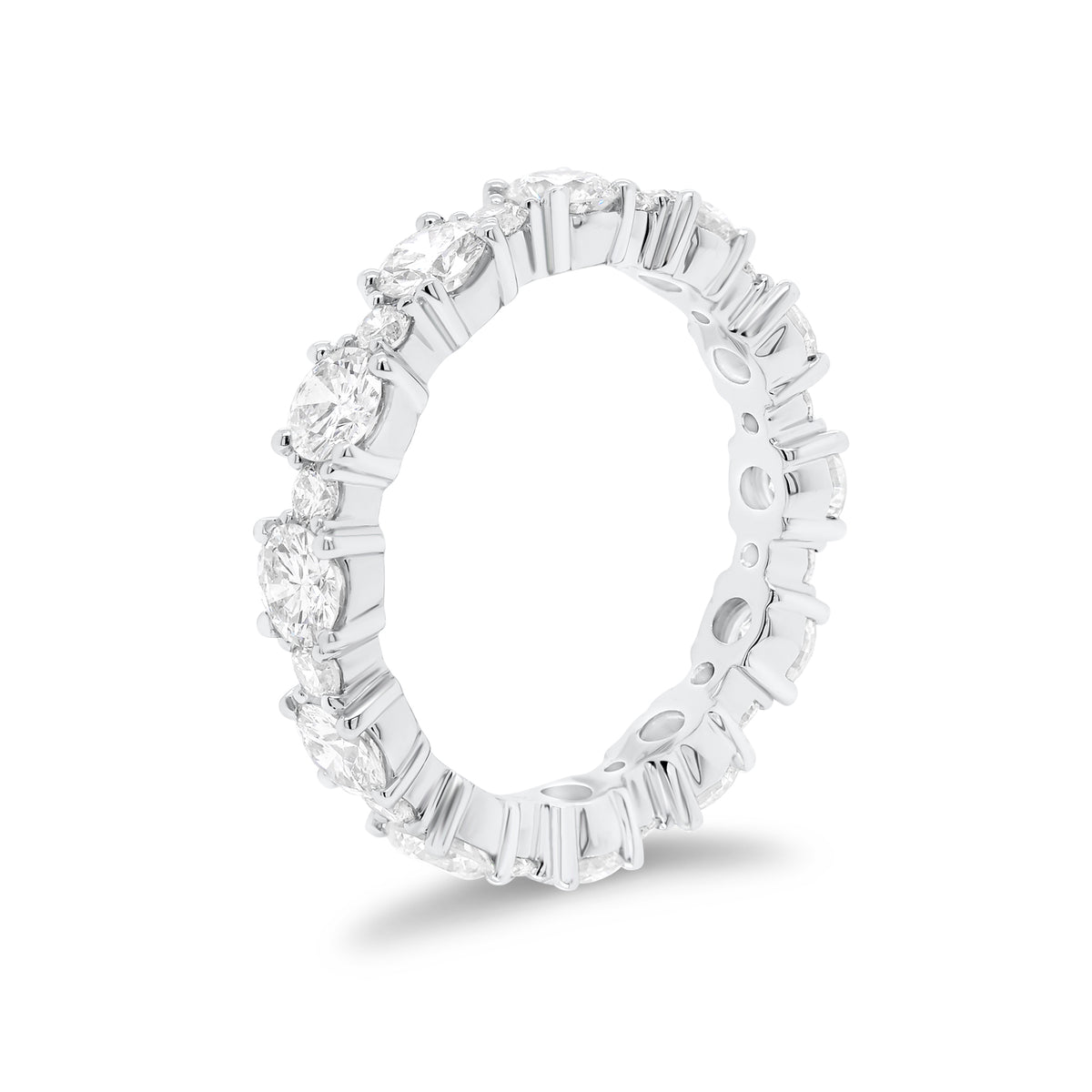 Diamond Eternity Band   -18K gold weighing 3.07 grams  -12 round diamonds totaling 2.13 carats  -12 round diamonds totaling 0.43 carats