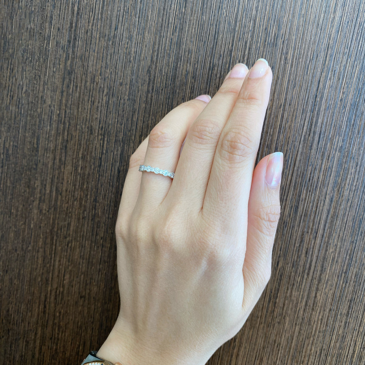 Female model wearing Diamond Milgrain Eternity Ring - 18K gold weighing 1.53 grams  - 30 round diamonds weighing 0.95 carats