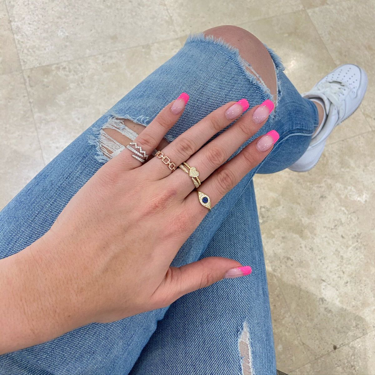 Female Model Wearing Diamond Heart Ring  - 14K gold weighing 1.61 grams  - 37 round diamonds totaling 0.12 carats