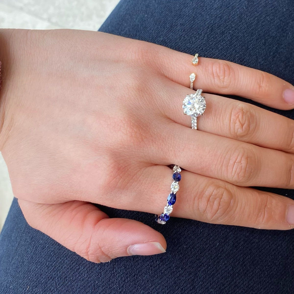 Sapphire & Diamond Eternity Ring - 18K gold weighing 2.67 grams  - 8 round diamonds totaling 1.10 carats  - 8 oval-shaped sapphires totaling 2.46 carats