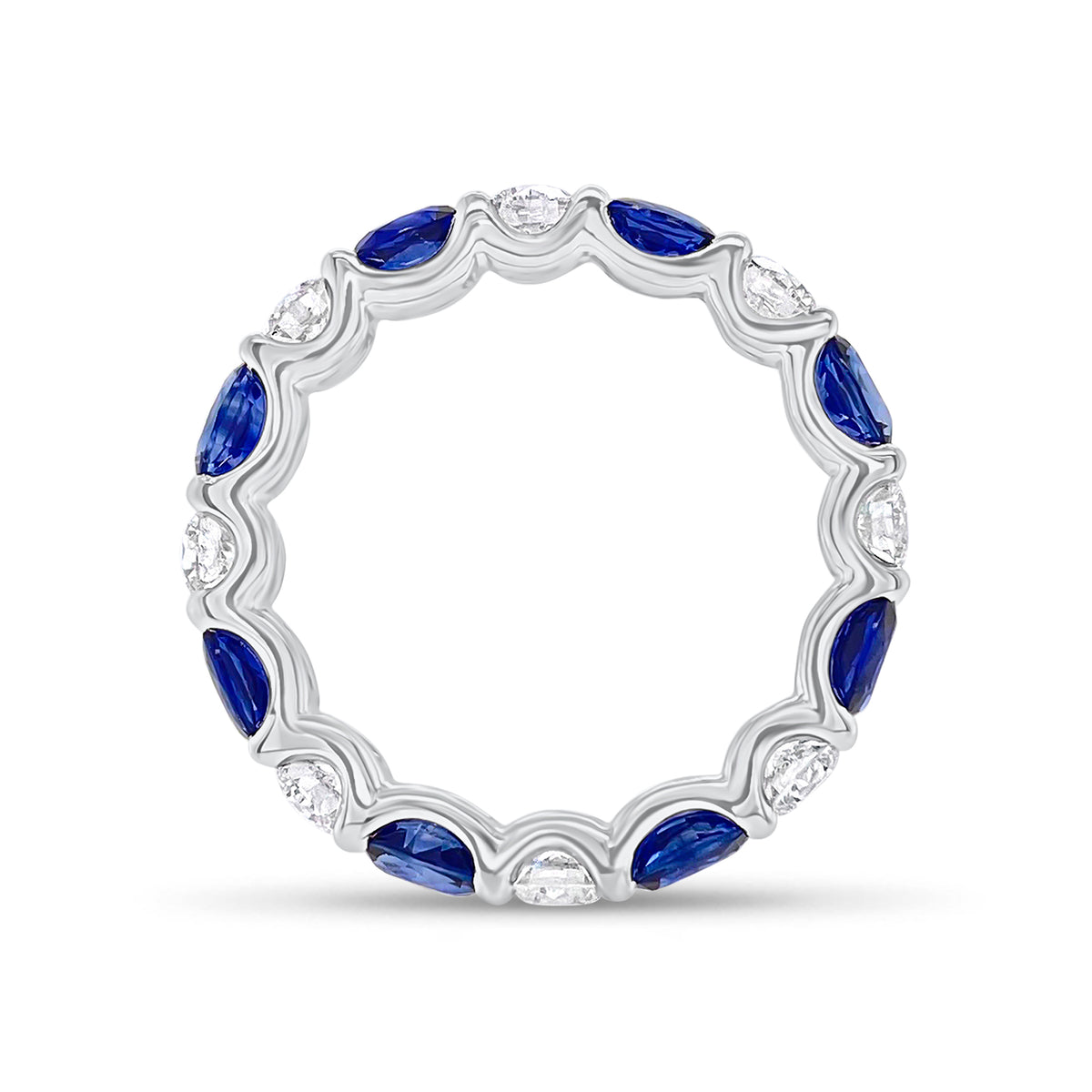 Sapphire & Diamond Eternity Ring - 18K gold weighing 2.67 grams - 8 round diamonds totaling 1.10 carats - 8 oval-shaped sapphires totaling 2.46 carats