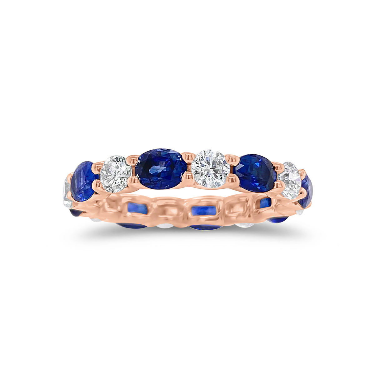 Sapphire & Diamond Eternity Ring - 18K gold weighing 2.67 grams - 8 round diamonds totaling 1.10 carats - 8 oval-shaped sapphires totaling 2.46 carats