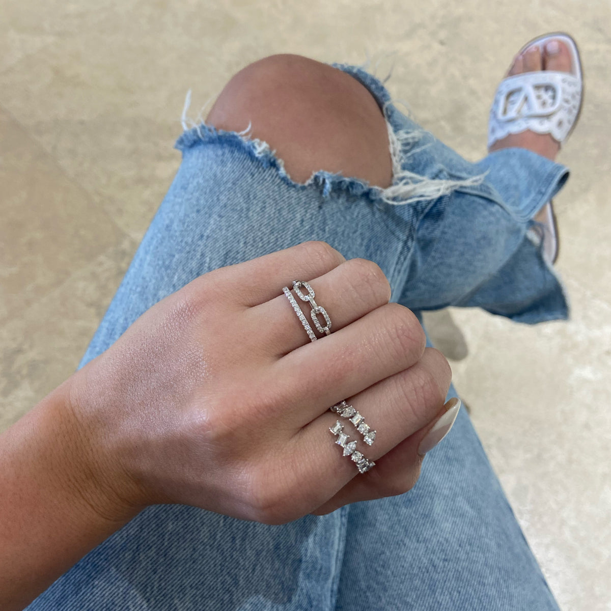 Female model wearing Diamond Rectangular Link Stackable Ring - 18K gold weighing 2.90 grams - 36 round diamonds totaling 0.18 carats