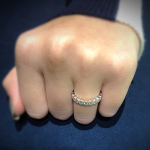 Female Model Wearing Bezel-Set Diamond Eternity Ring with Antique Milgrain  -14k gold weighing 3.7 grams  -20 round bezel-set diamonds weighing 1.57 carats 