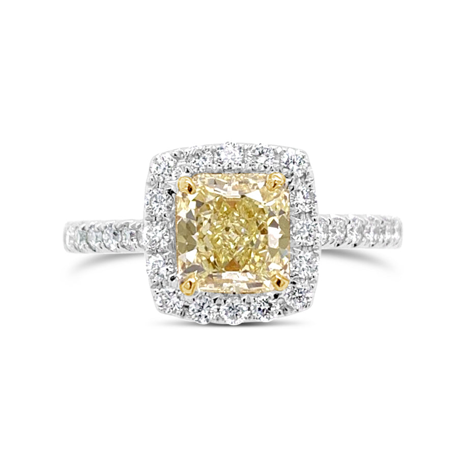 Radiant-cut Yellow Diamond Engagement Ring  -18k gold weighing 3.74 grams  -30 round diamonds weighing .48 carats  -1 yellow diamond radiant-cut weighing 1.25 carats with GIA-VS1 clarity