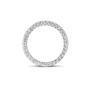 Simple diamond eternity band ring -18k gold weighing 1.61 grams  -34 round four prong-set diamonds weighing .84 carats 