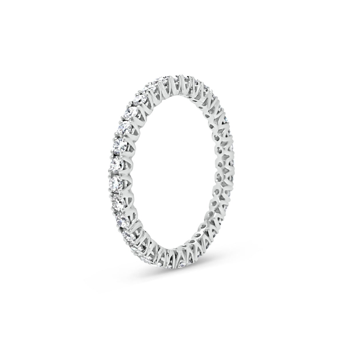 Simple diamond eternity band ring -18k gold weighing 1.61 grams  -34 round four prong-set diamonds weighing .84 carats 