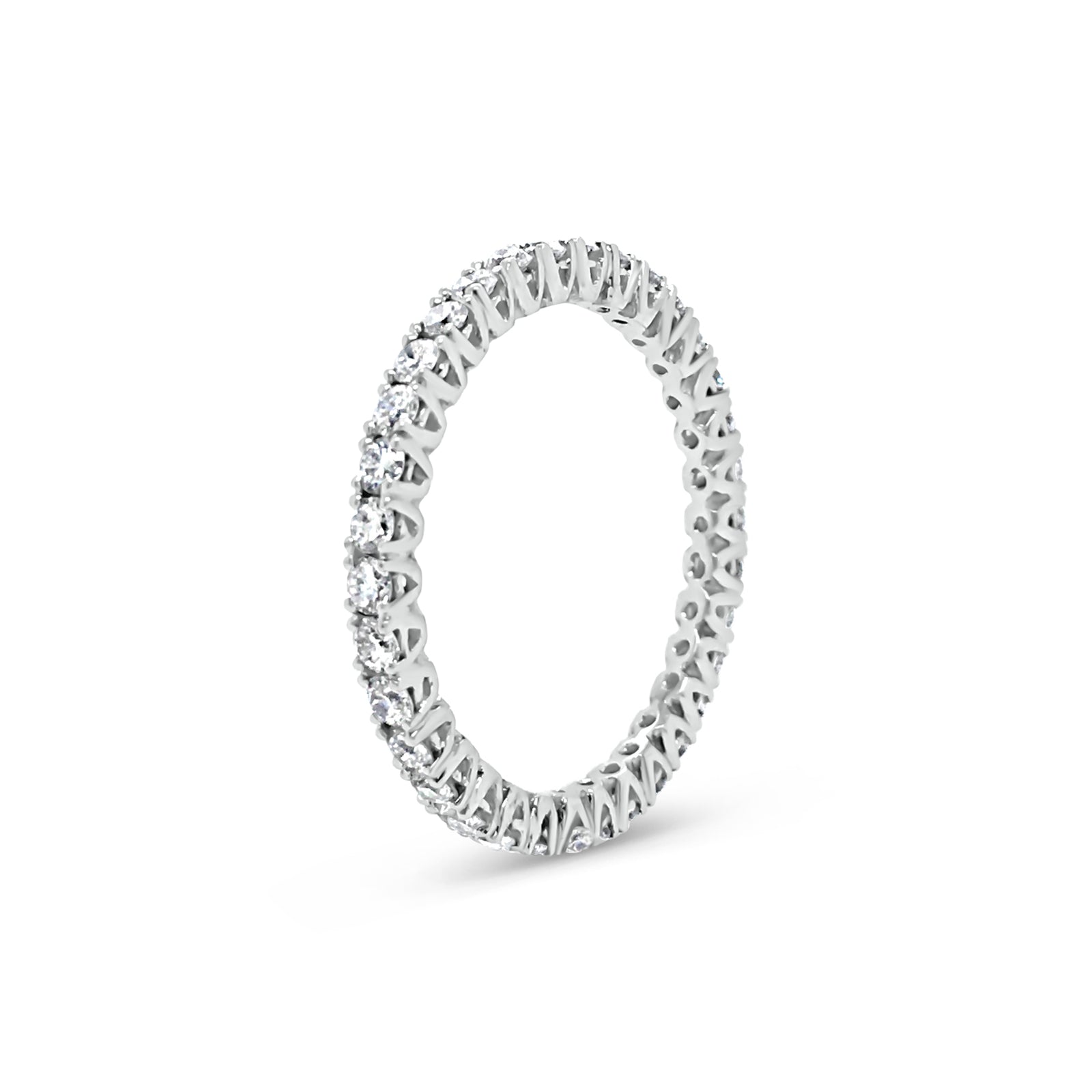 Simple diamond eternity band ring -18k gold weighing 1.61 grams  -34 round four prong-set diamonds weighing .84 carats 