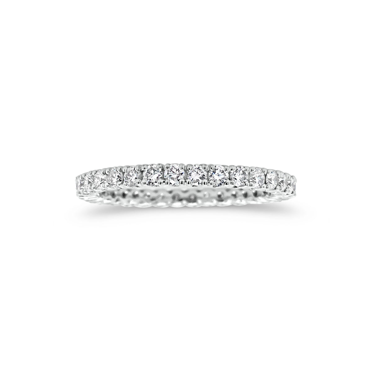 Simple diamond eternity band ring -18k gold weighing 1.61 grams  -34 round four prong-set diamonds weighing .84 carats 