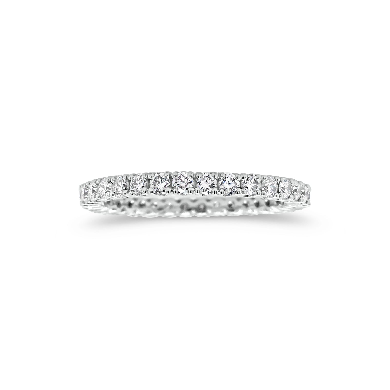 Simple diamond eternity band ring -18k gold weighing 1.61 grams  -34 round four prong-set diamonds weighing .84 carats 