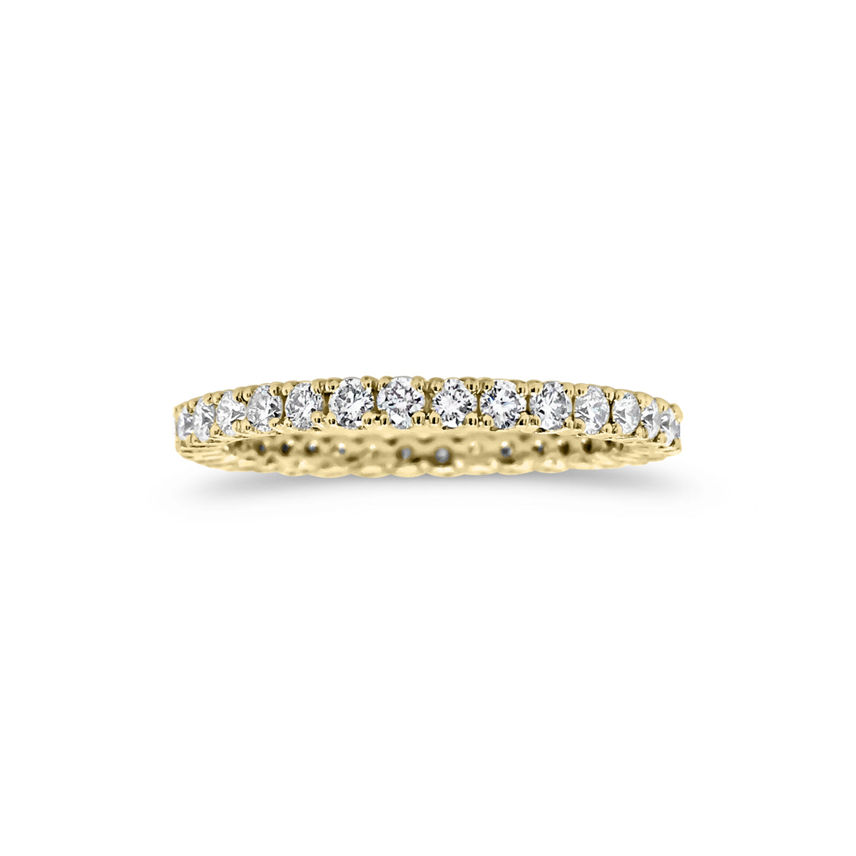 Simple diamond eternity band ring -18k gold weighing 1.61 grams  -34 round four prong-set diamonds weighing .84 carats 
