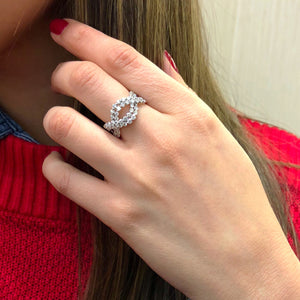 Female Model Wearing Diamond Twist Fashion Ring  -18k gold weighing 4.3 grams  -58 round diamonds weighing 1.42 carats
