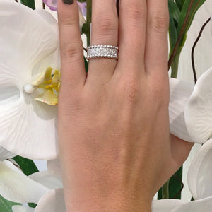 Female Model Wearing Two-tone Beaded Diamond Ring  18k gold, 5.22 grams, 90 round shared prong-set brilliant diamonds 1.41 carats.