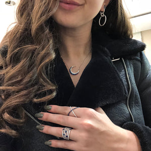 Female model wearing Blue Sapphire & Diamond Multi-row Band  18k gold, 5.97 grams, 5 round bezel-set sapphire .78 carats, 91 round shared prong-set diamonds .84 carats.