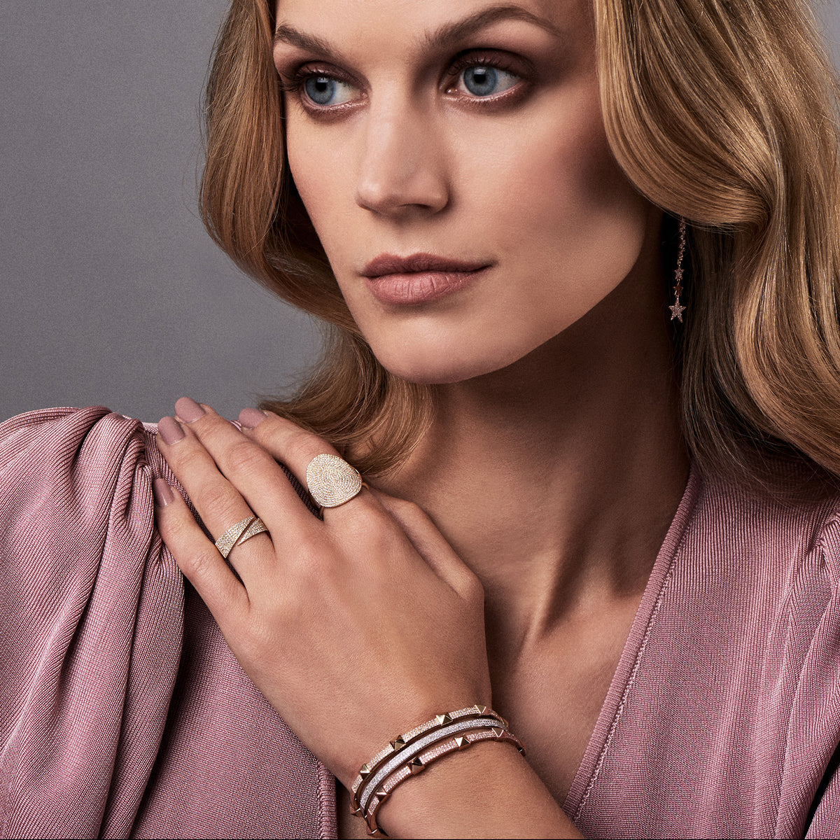 Female Model Wearing Pave Diamond Wide Coil Ring  - 14K gold weighing 3.31 grams  - 178 round diamonds totaling 0.42 carats