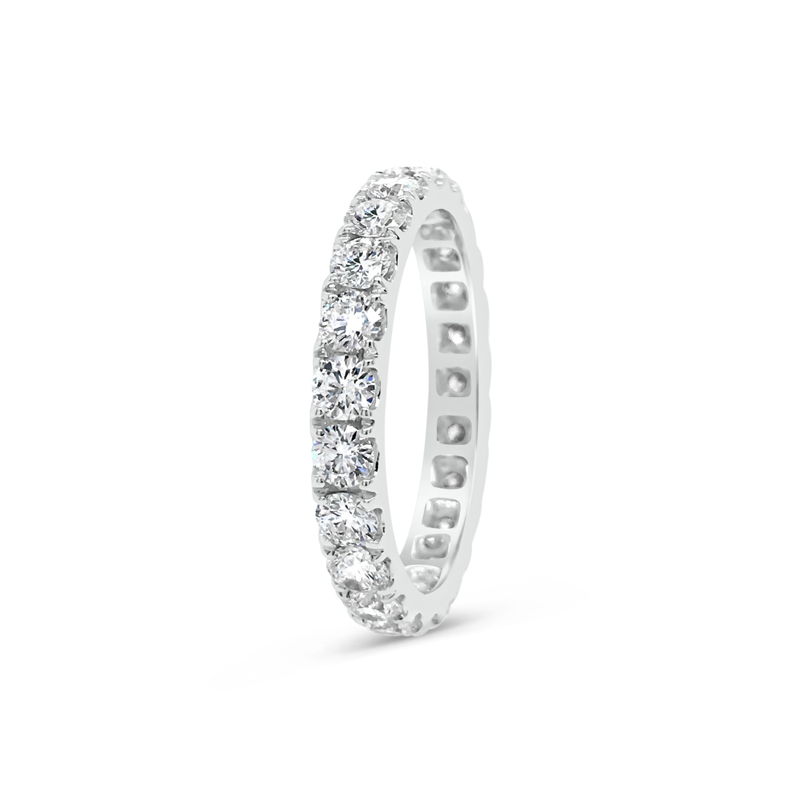 Four Prong-Set Diamond Eternity Band  -18k gold weighing 2.62 grams  -23 round diamonds weighing 1.68 carats