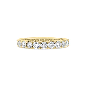 Four Prong-Set Diamond Eternity Band  -18k gold weighing 2.62 grams  -23 round diamonds weighing 1.68 carats