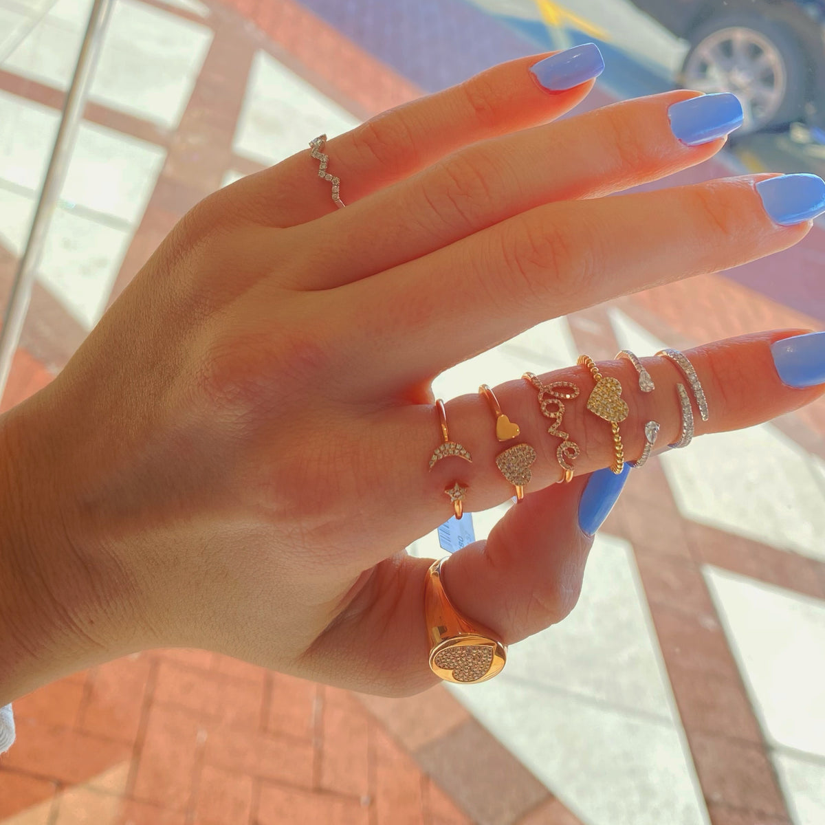 Female model wearing Diamond butterfly open ring - 14K gold weighing 1.68 grams - 29 round diamonds totaling 0.07 carats