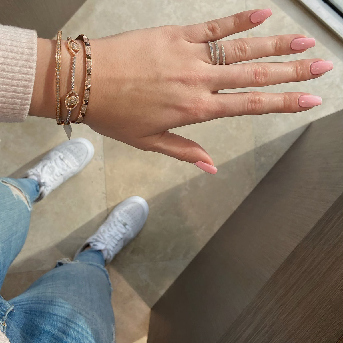 Female model wearing Skinny Pave Diamond Pyramid Stud Bangle Bracelet - 14K gold weighing 13.86 grams - 252 round diamonds totaling 0.95 carats