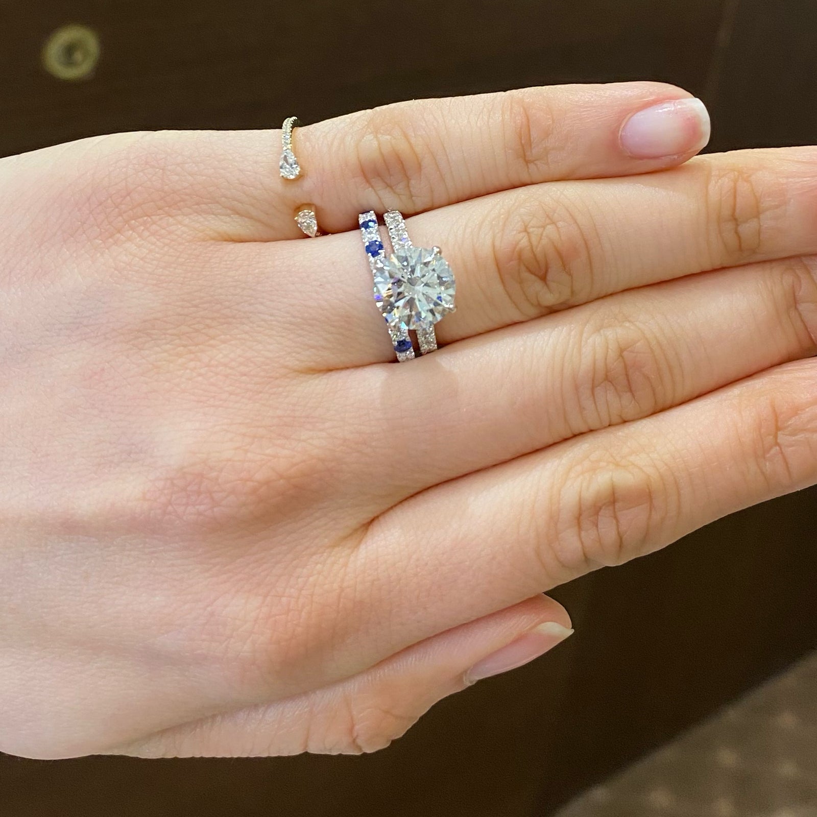 Sapphire & Diamond Band  - 18K gold weighing 2.0 grams  - 7 round diamonds totaling 0.22 carats  - 8 sapphires totaling 0.35 carats