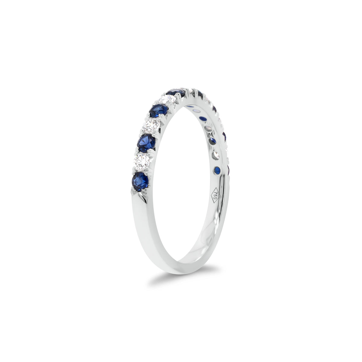 Sapphire & Diamond Band  - 18K gold weighing 2.0 grams  - 7 round diamonds totaling 0.22 carats  - 8 sapphires totaling 0.35 carats