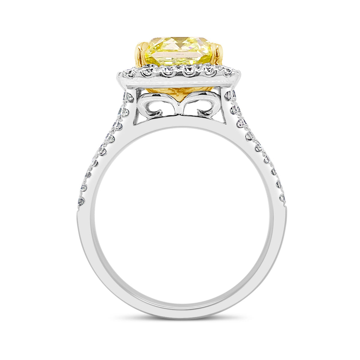 Fancy Light Yellow Radiant Halo Diamond Engagement Ring  - 18 kt white gold weighting 6.09 grams  - 68 round diamonds totaling 0.93 carats  - 1 Fancy light yellow radiant cut totaling 3.29 VS2-GIA