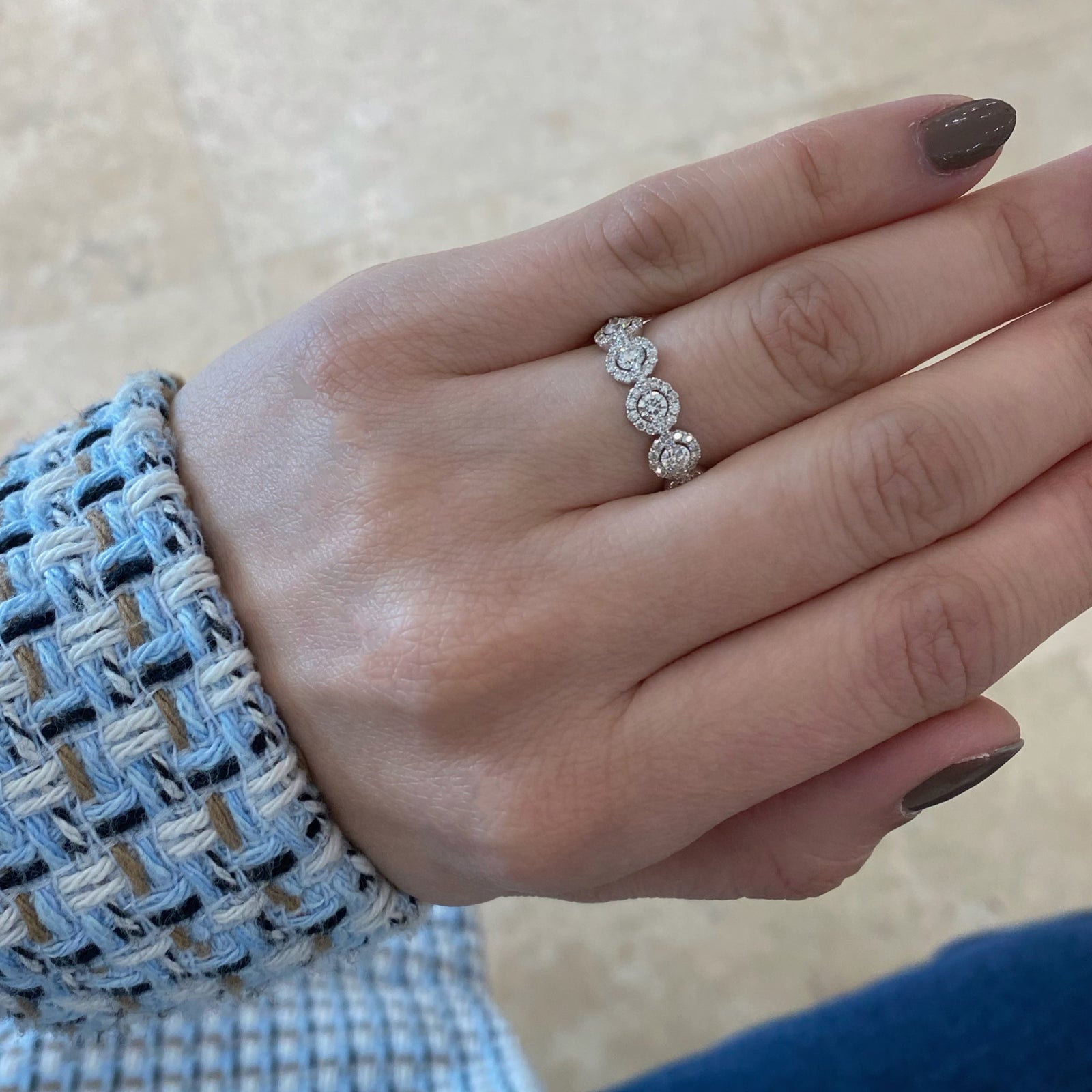 Circular Diamond Eternity Ring  -18k gold weighing 3.07 grams  -11 round diamonds weighing 1.12 carats  -143 round diamonds weighing .78 carats