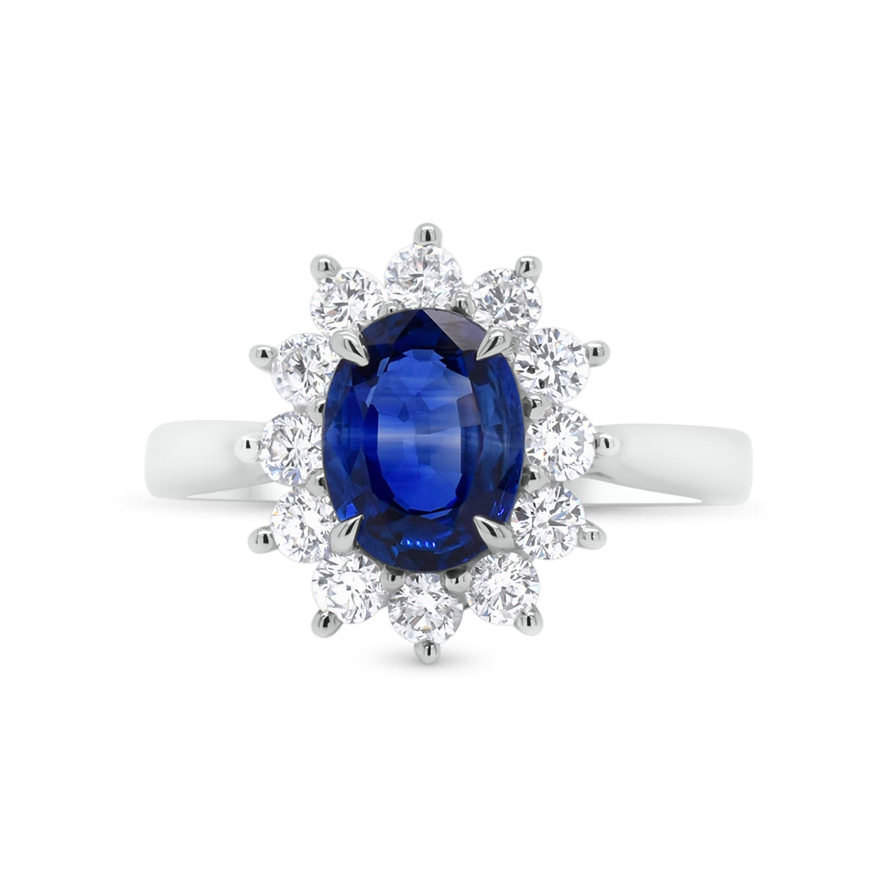 Sapphire & diamond classic ring - 18K gold weighing 3.32 grams  - 12 round diamonds totaling 0.58 carats  - 1.61 ct sapphire