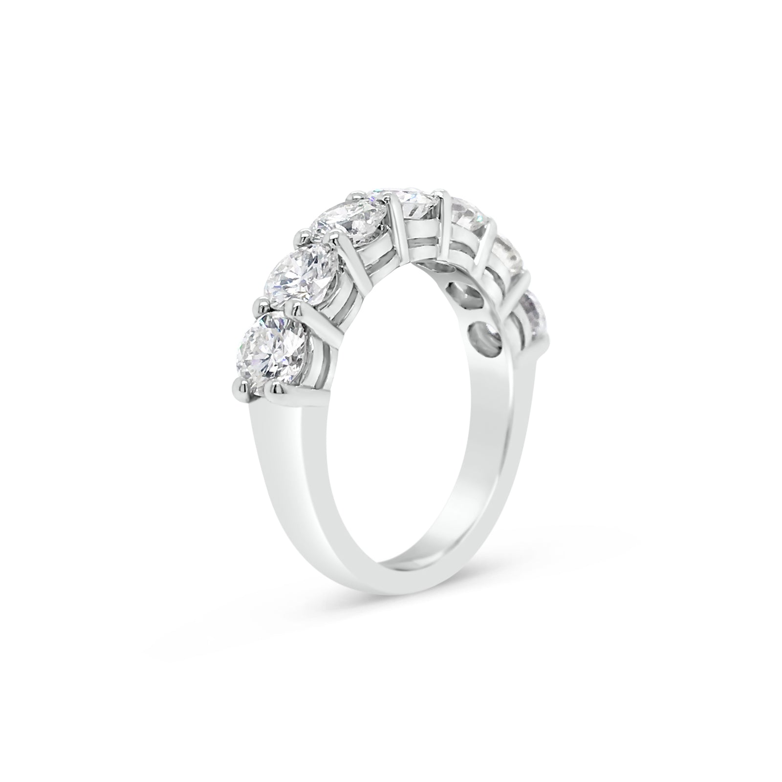7 Stone Diamond Wedding Band  -14k gold weighing 5.0 grams  -7 round shared prong-set diamonds weighing 2.35 carats