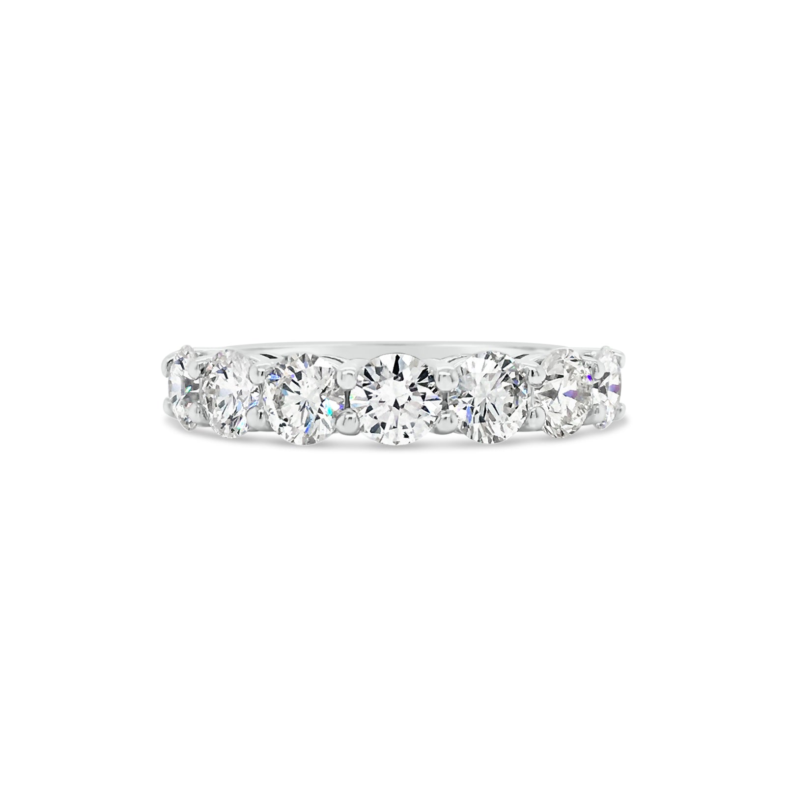 7 Stone Diamond Wedding Band  -14k gold weighing 5.0 grams  -7 round shared prong-set diamonds weighing 2.35 carats