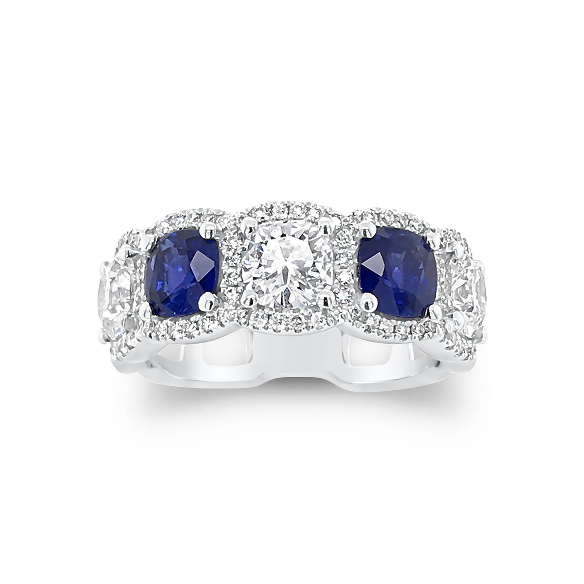Cushion cut diamond and sapphire band -18k gold weighing 5.52 grams weighing  -84 round diamonds weighing .31 carats  -2 Sapphires -1.70cts  -3 Cushion cut diamonds - 1.56cts