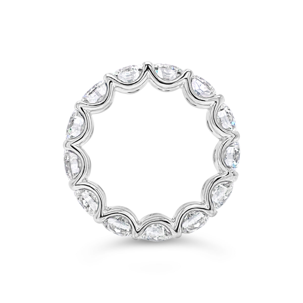 Diamond Eternity Ring  - 18K gold weighing 9.20 grams  - 13 round diamonds totaling 6.87 carats (GIA-graded E-G color, VVS2-SI2 clarity)