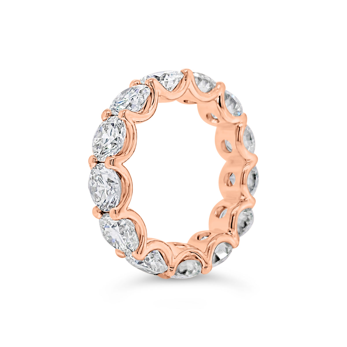 Diamond Eternity Ring  - 18K gold weighing 9.20 grams  - 13 round diamonds totaling 6.87 carats (GIA-graded E-G color, VVS2-SI2 clarity)
